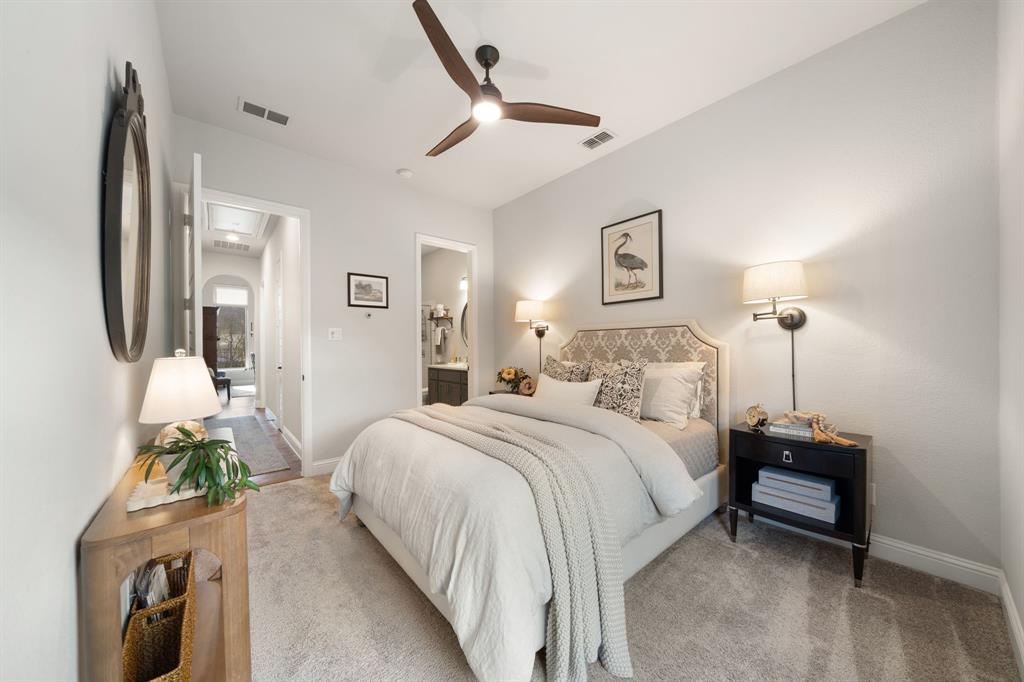 16509 Prairie Oak Road Frisco, TX 75033 - Photo 26 of 39 a bedroom with a bed table and chair