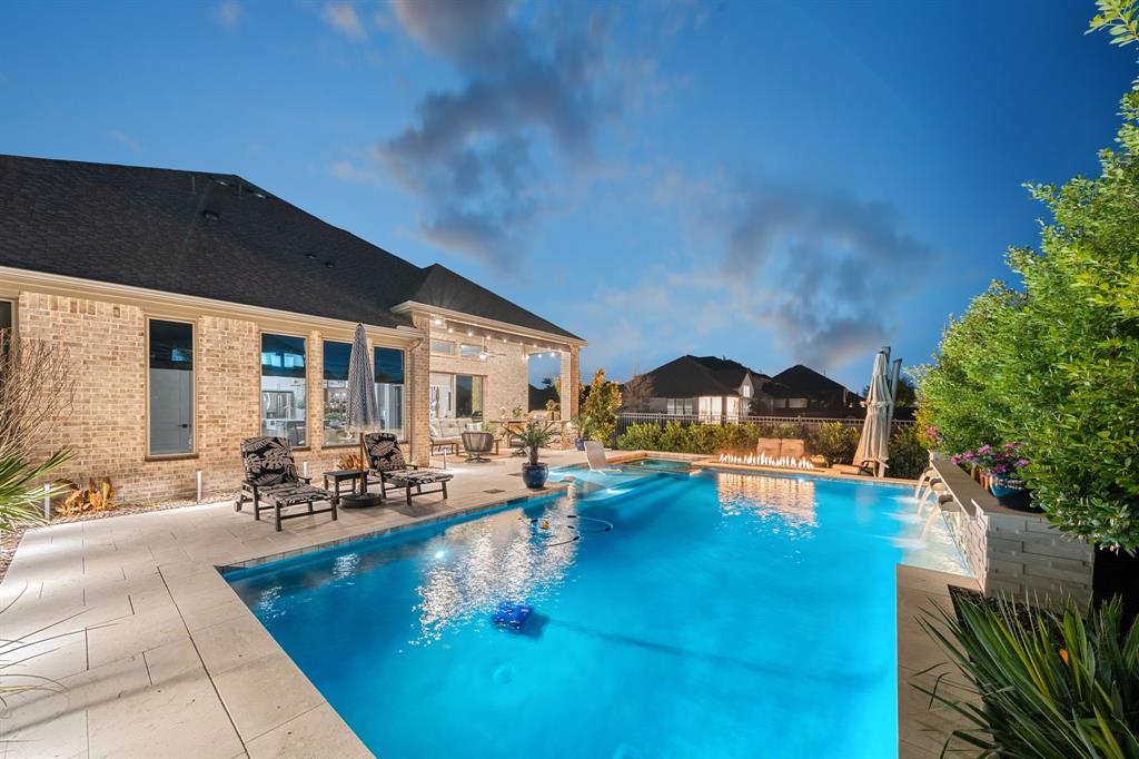 16509 Prairie Oak Road Frisco, TX 75033 - Photo 37 of 39 a view of a patio with swimming pool table and chairs
