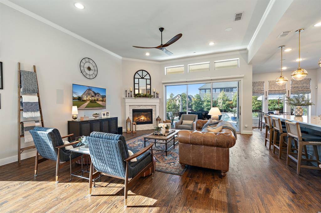 16509 Prairie Oak Road Frisco, TX 75033 - Photo 6 of 39 a living room with furniture and a fireplace
