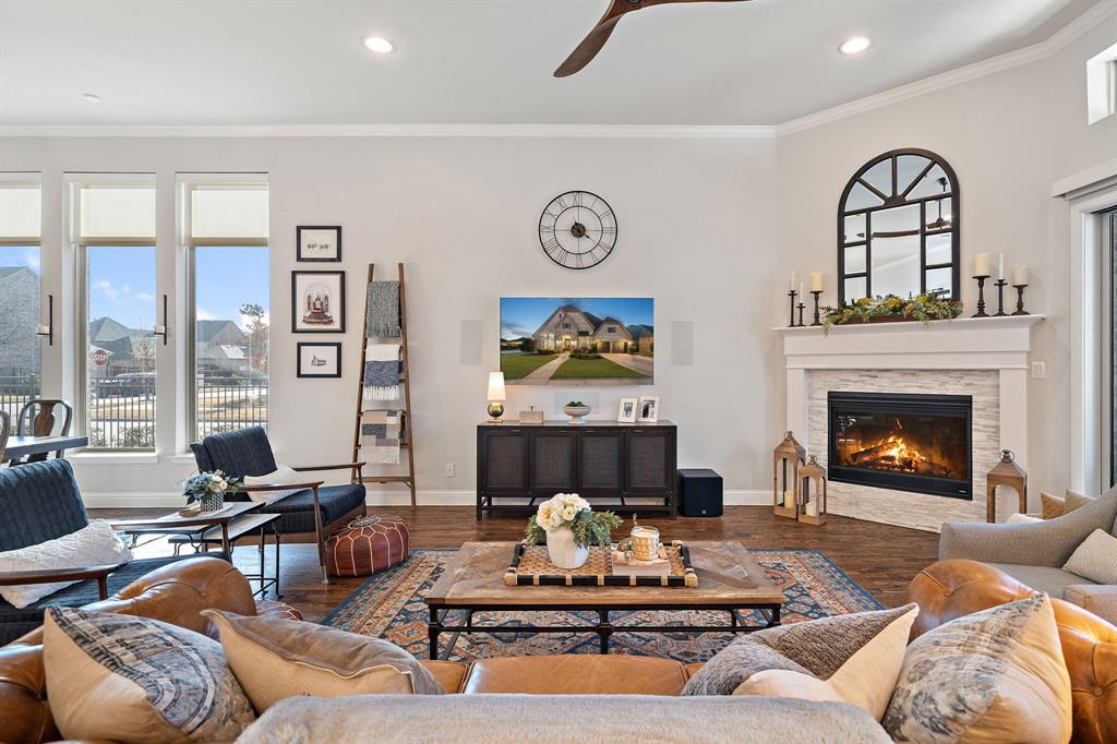 16509 Prairie Oak Road Frisco, TX 75033 - Photo 9 of 39 a living room with furniture and a fireplace