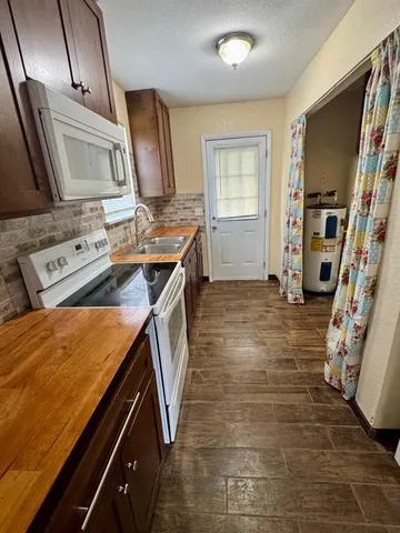a view of storage and utility room with washer and dryer