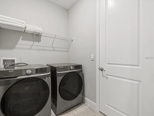 a utility room with dryer and washer