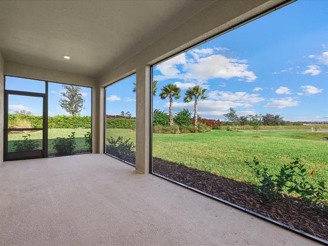 a view of a garden with an outdoor seating