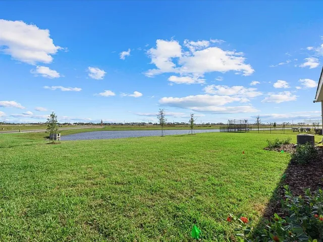 a view of a golf course with green space