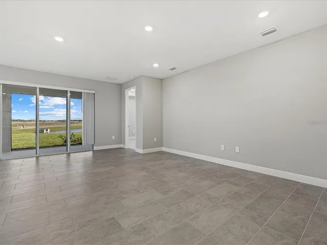 a view of an empty room with a sliding door