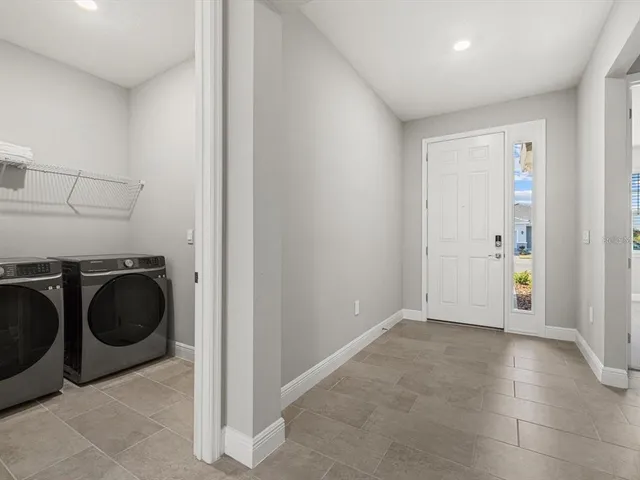a view of a storage & utility room with washer and dryer
