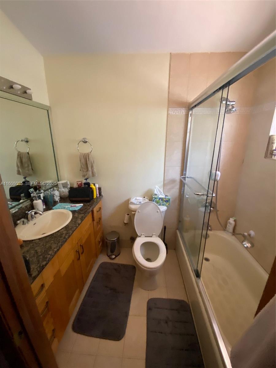1632 Southwest 19th Terrace Miami, FL 33145 - Photo 11 of 16 a bathroom with a sink and mirror