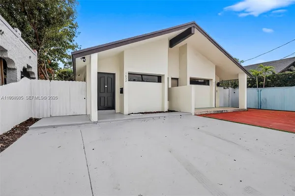 a front view of a house with a garage