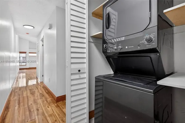 a view of an entryway with wooden floor