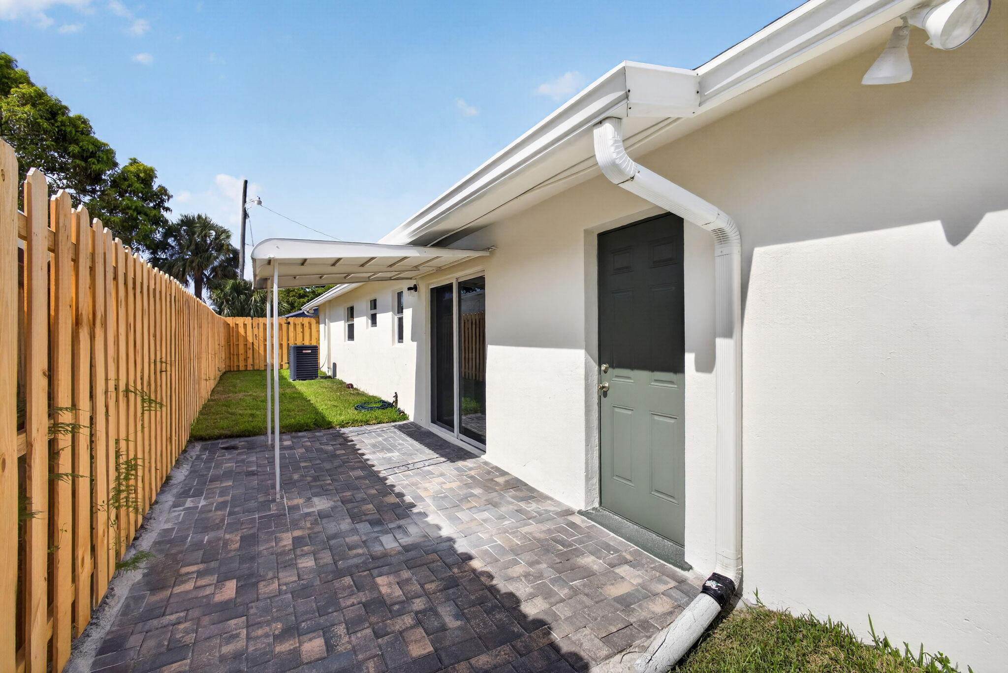 665 West 7th Street Riviera Beach, FL 33404 - Photo 51 of 62 Covered paver brick patio