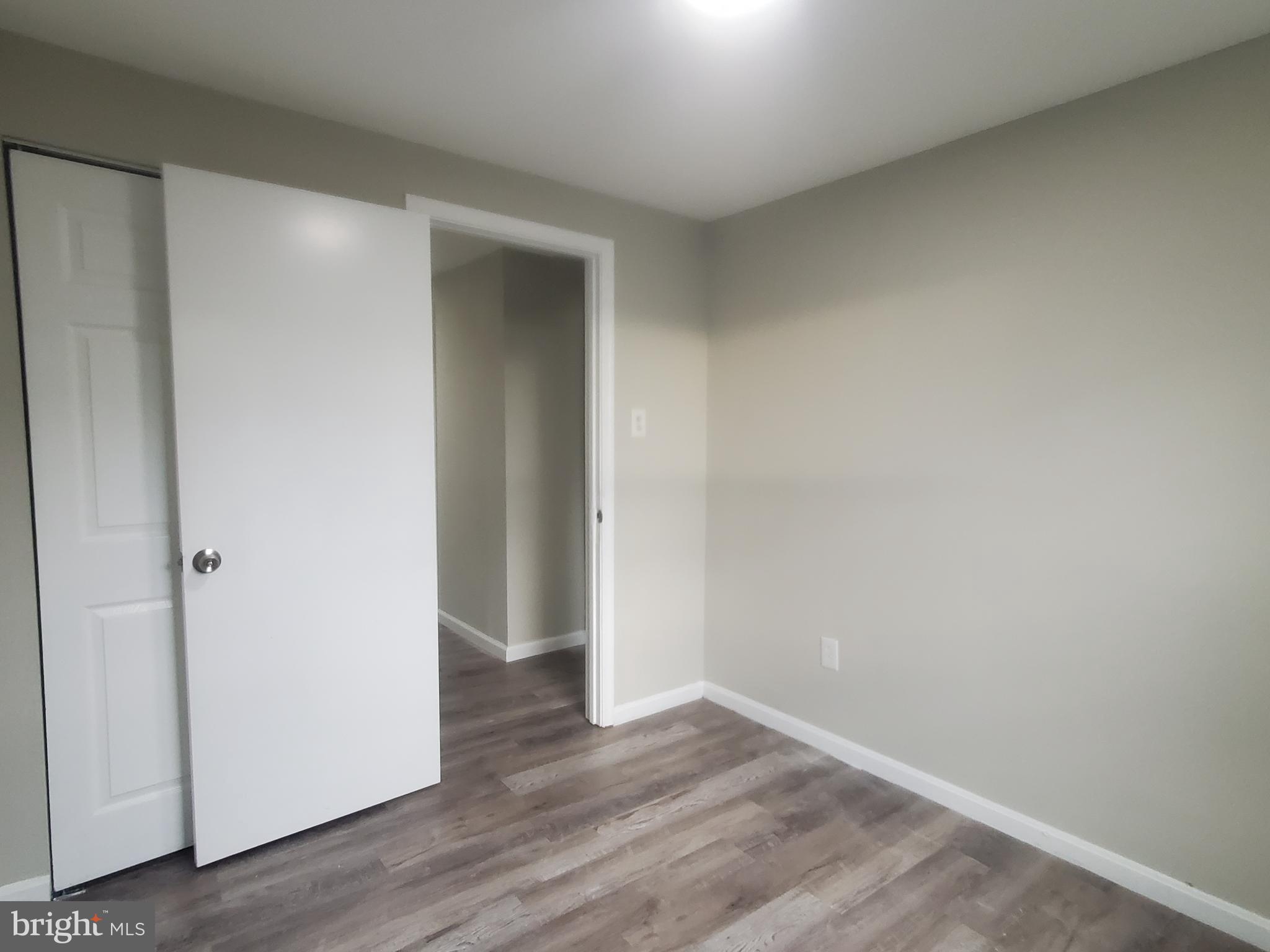 14813 Hammersmith Circle Silver Spring, MD 20906 - Photo 19 of 36 a view of an empty room with wooden floor