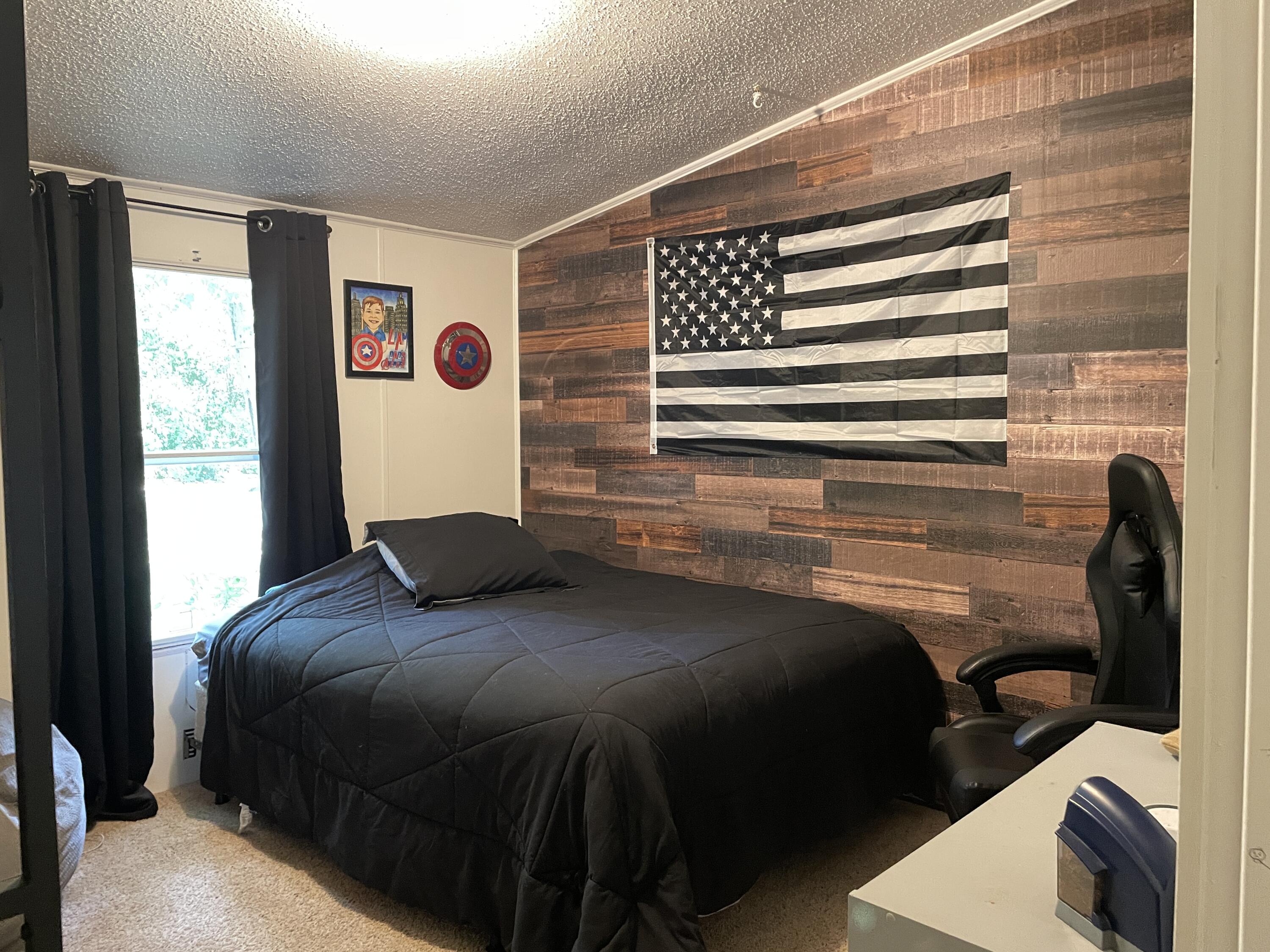 2166 Healing Springs Road Blackville, SC 29817 - Photo 23 of 43 a bedroom with a bed and a window