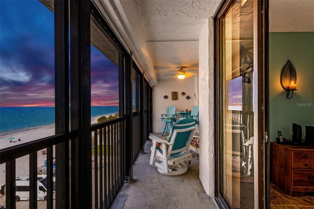 14900 Gulf Boulevard, Unit 410 Madeira Beach, FL 33708 - Photo 73 of 76 a view of a porch with wooden floor and a potted plant