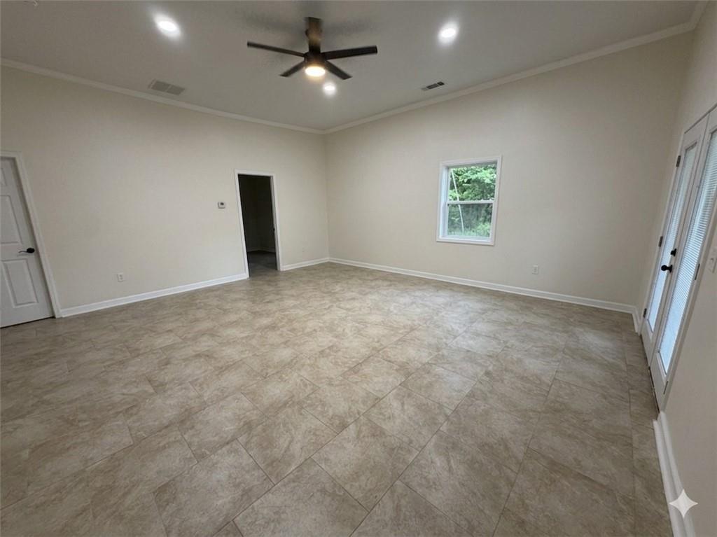 3763 Elkridge Drive Decatur, GA 30032 - Photo 20 of 20 an empty room with a ceiling fan and a window