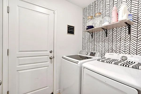 a utility room with dryer and washer