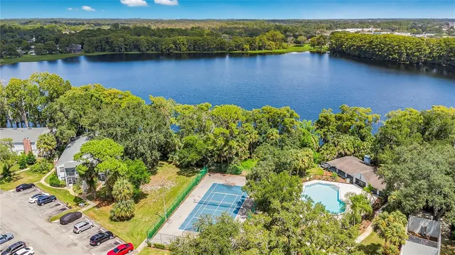 an aerial view of a house with a lake view