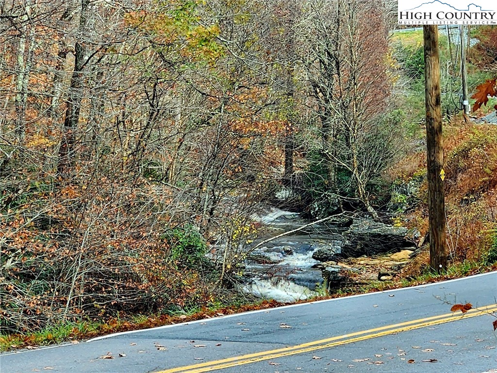 2876 Howard's Creek Road Boone, NC 28607 - Photo 32 of 34 a view of a yard from a window