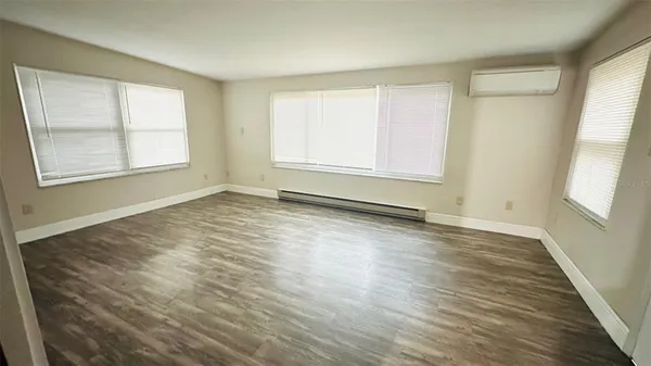 a view of a storage and utility room with refrigerator washer and dryer