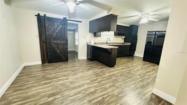 a kitchen with a sink a stove and cabinets