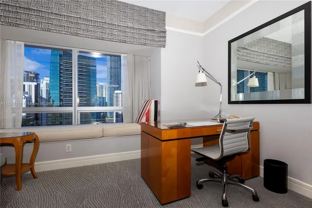 a reading room with furniture and a window