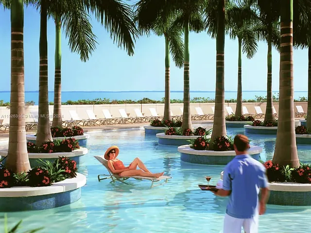 a view of swimming pool with a table and chairs