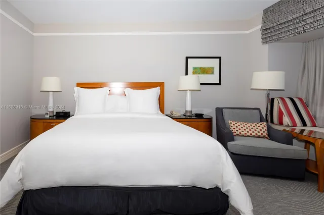 a bedroom with bed and a couch