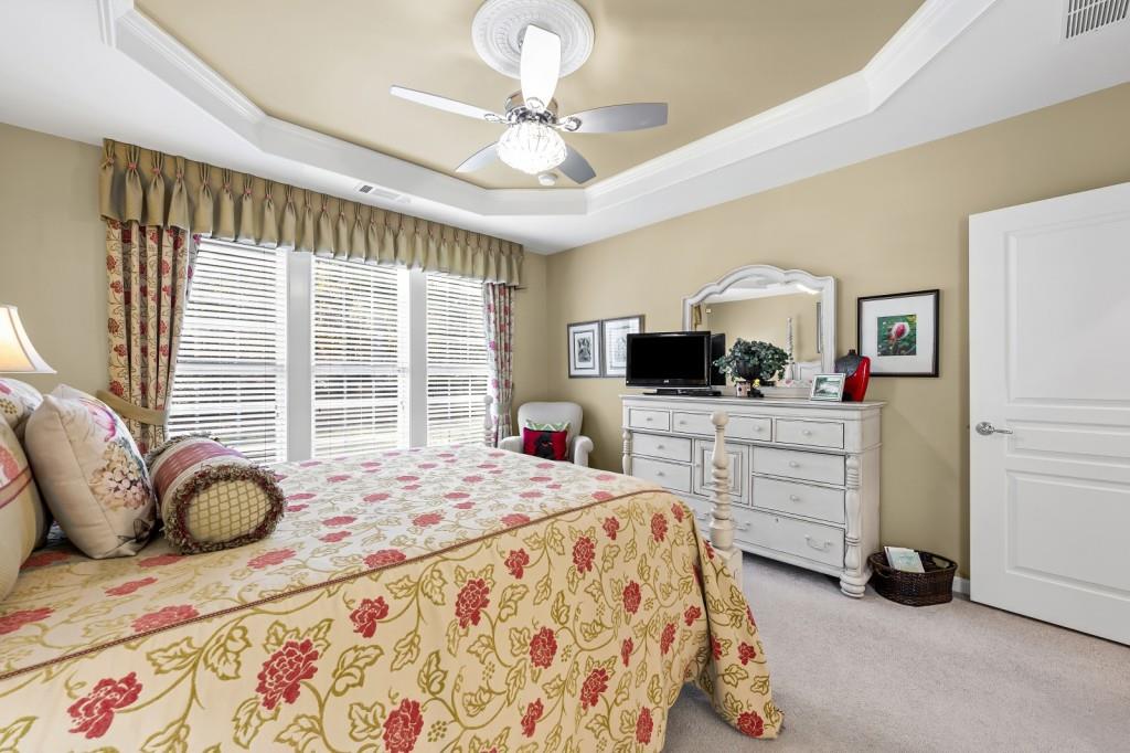 1081 Spring Station Road Greensboro, GA 30642 - Photo 20 of 35 a bedroom with a bed a furniture and a flat screen tv