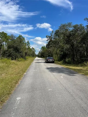 a view of a road with an ocean view