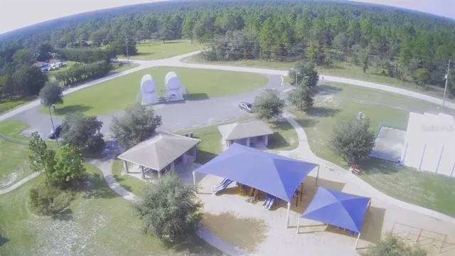 an aerial view of a house with outdoor space