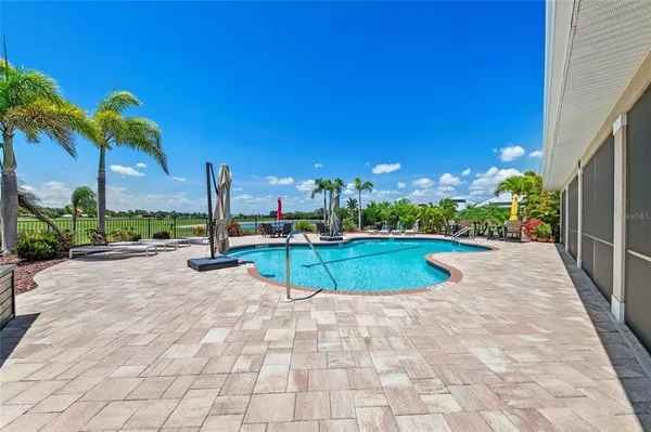 a view of a swimming pool with a patio