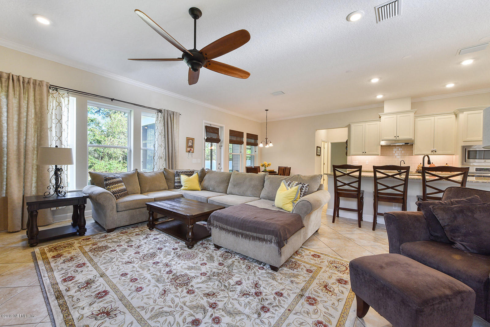 16396 Tisons Bluff Road Jacksonville, FL 32218 - Photo 15 of 30 a living room with furniture kitchen view and a large window