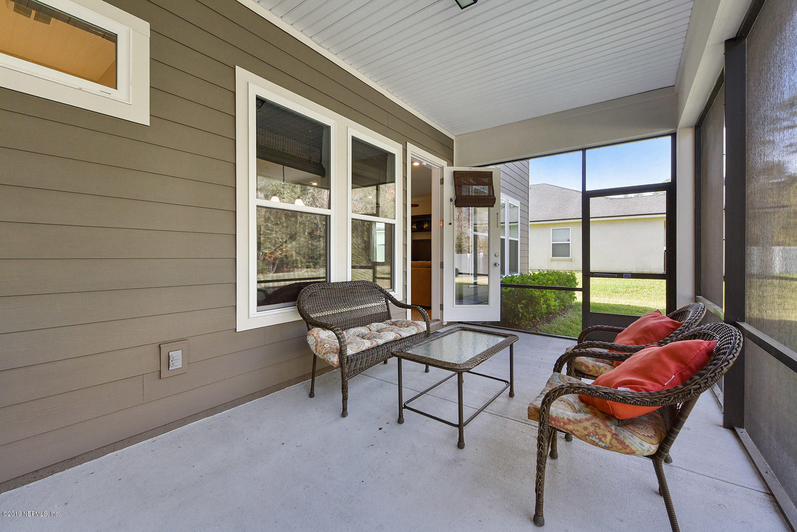 16396 Tisons Bluff Road Jacksonville, FL 32218 - Photo 27 of 30 a building outdoor space with patio furniture