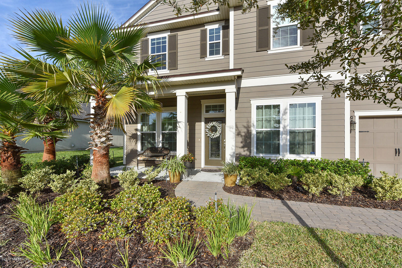 16396 Tisons Bluff Road Jacksonville, FL 32218 - Photo 5 of 30 front view of a brick house with a small yard