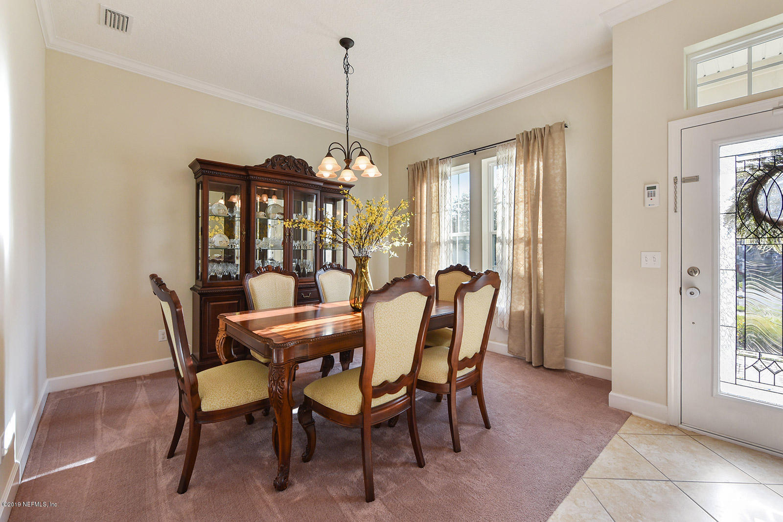 16396 Tisons Bluff Road Jacksonville, FL 32218 - Photo 7 of 30 a view of a dining room with furniture window and outside view