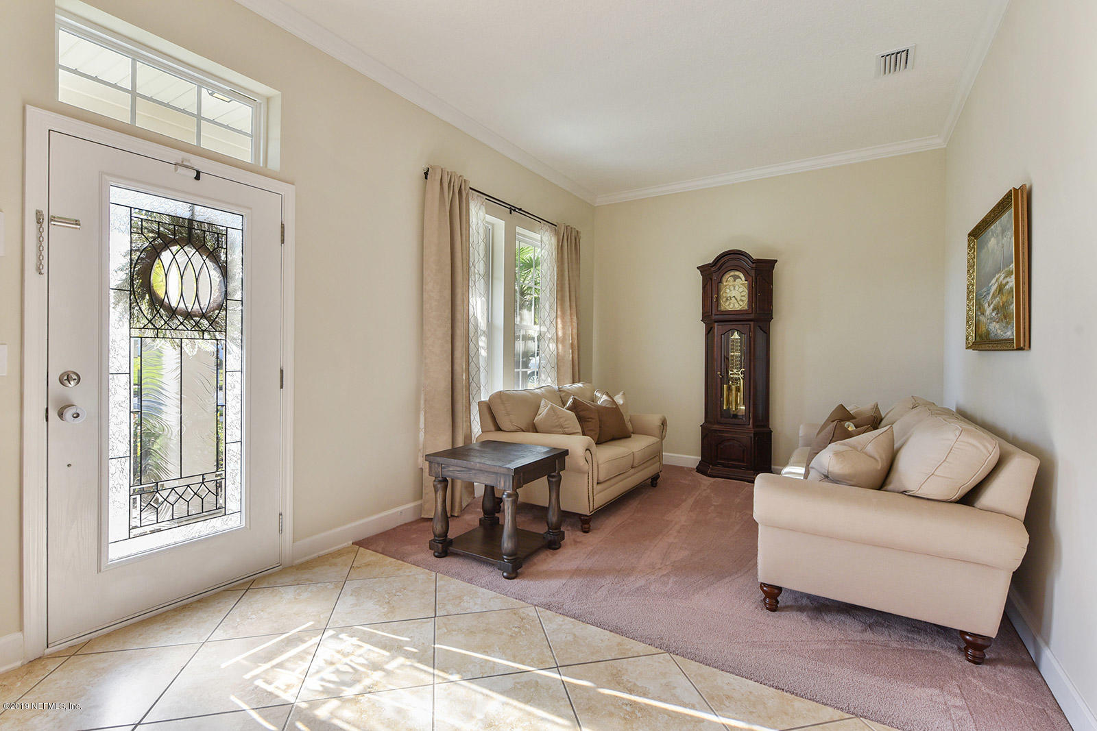 16396 Tisons Bluff Road Jacksonville, FL 32218 - Photo 8 of 30 a living room with furniture and a window