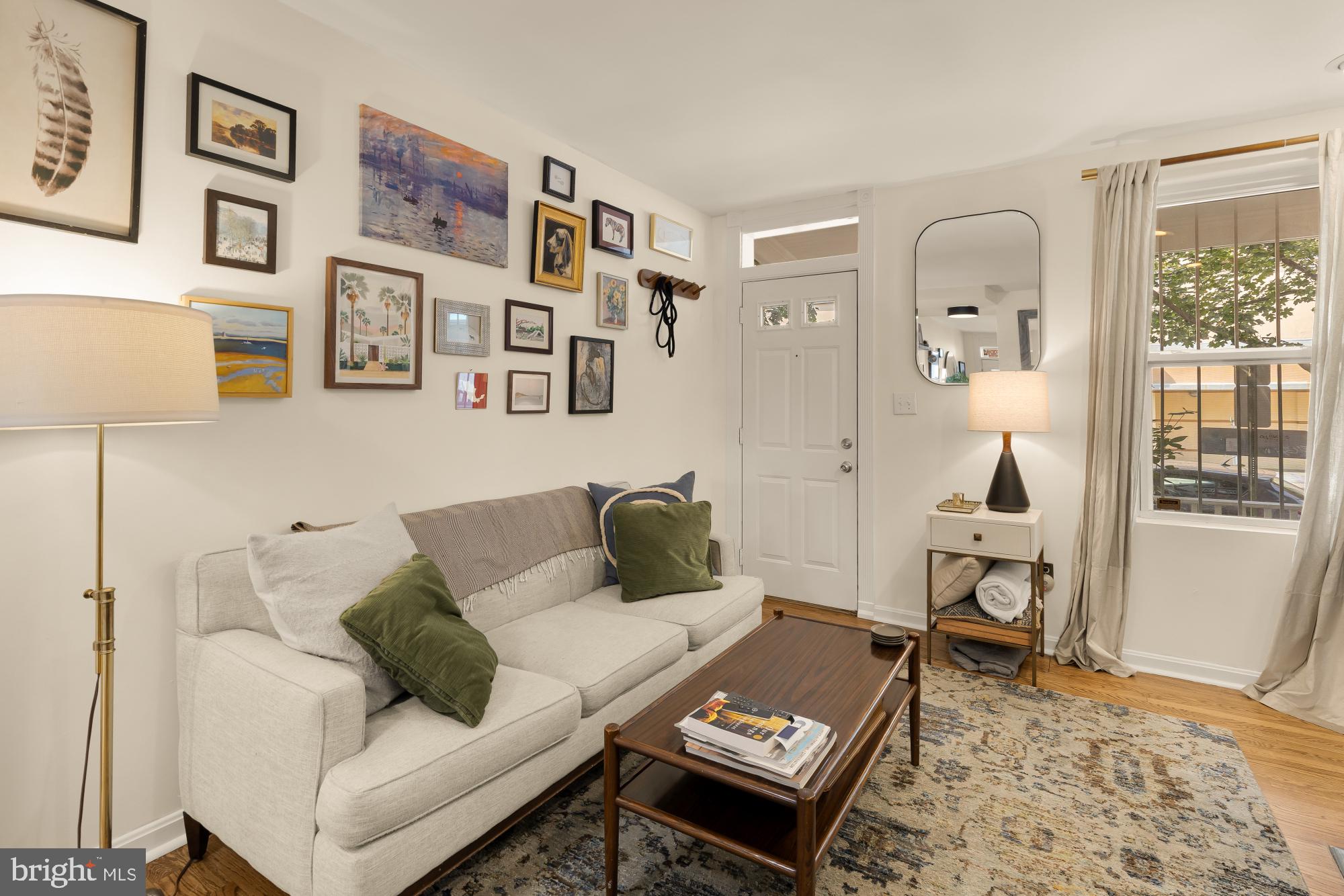 1652 Kalorama Road Northwest Washington, DC 20009 - Photo 11 of 17 a living room with furniture and wooden floor