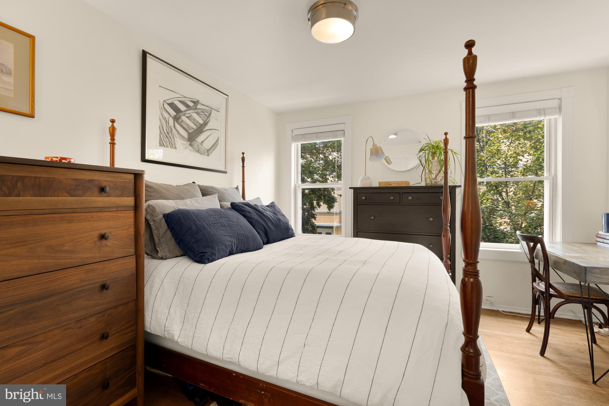 1652 Kalorama Road Northwest Washington, DC 20009 - Photo 12 of 17 a bedroom with a bed and a dresser
