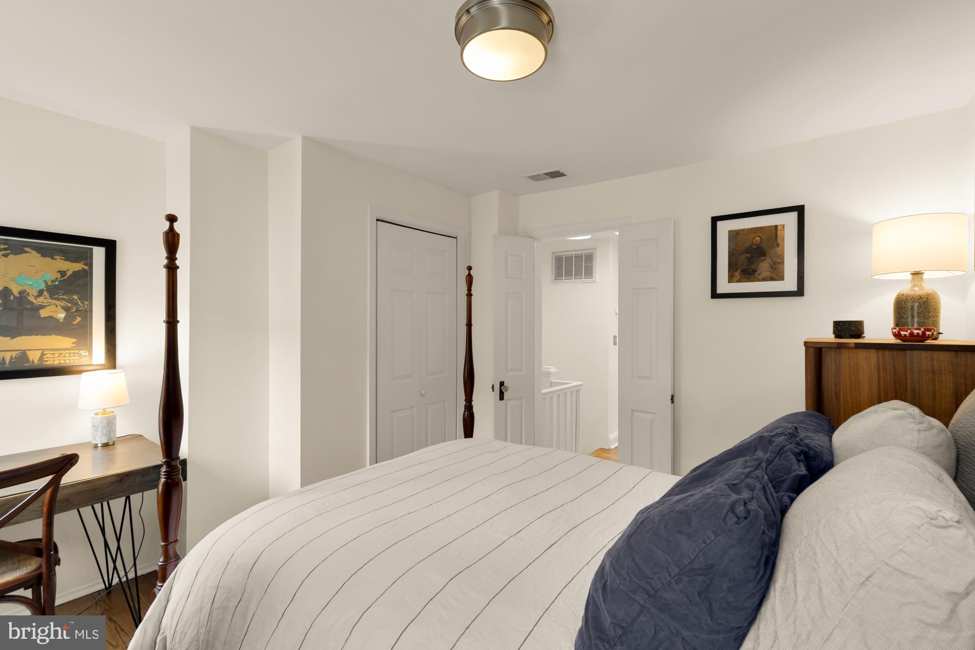 1652 Kalorama Road Northwest Washington, DC 20009 - Photo 13 of 17 a bedroom with a bed and a flat screen tv