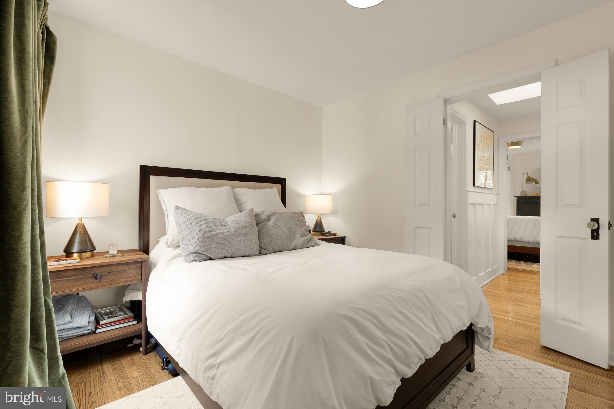 1652 Kalorama Road Northwest Washington, DC 20009 - Photo 15 of 17 a bedroom with a bed and a lamp