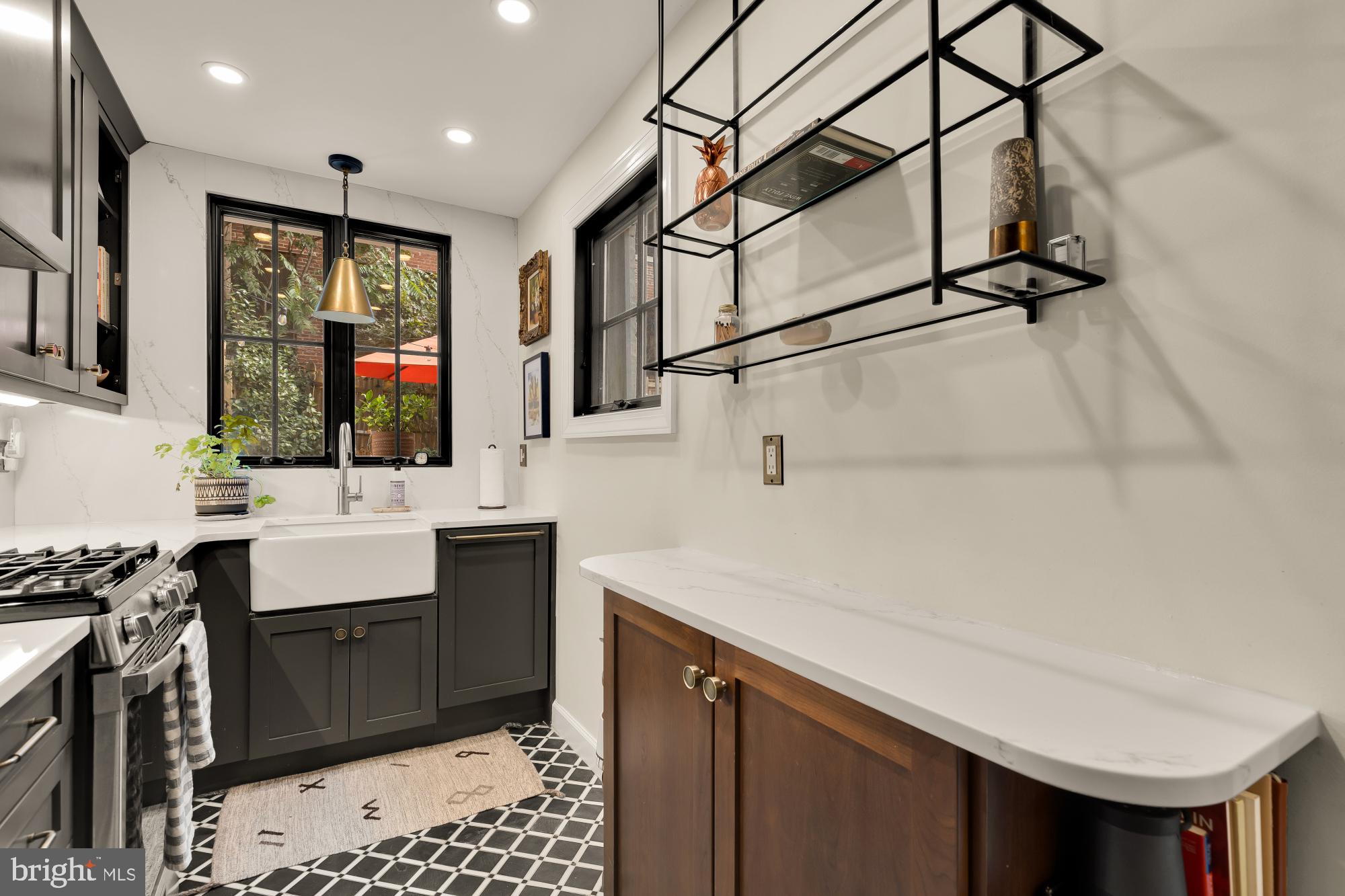 1652 Kalorama Road Northwest Washington, DC 20009 - Photo 4 of 17 a kitchen with a sink appliances and cabinets