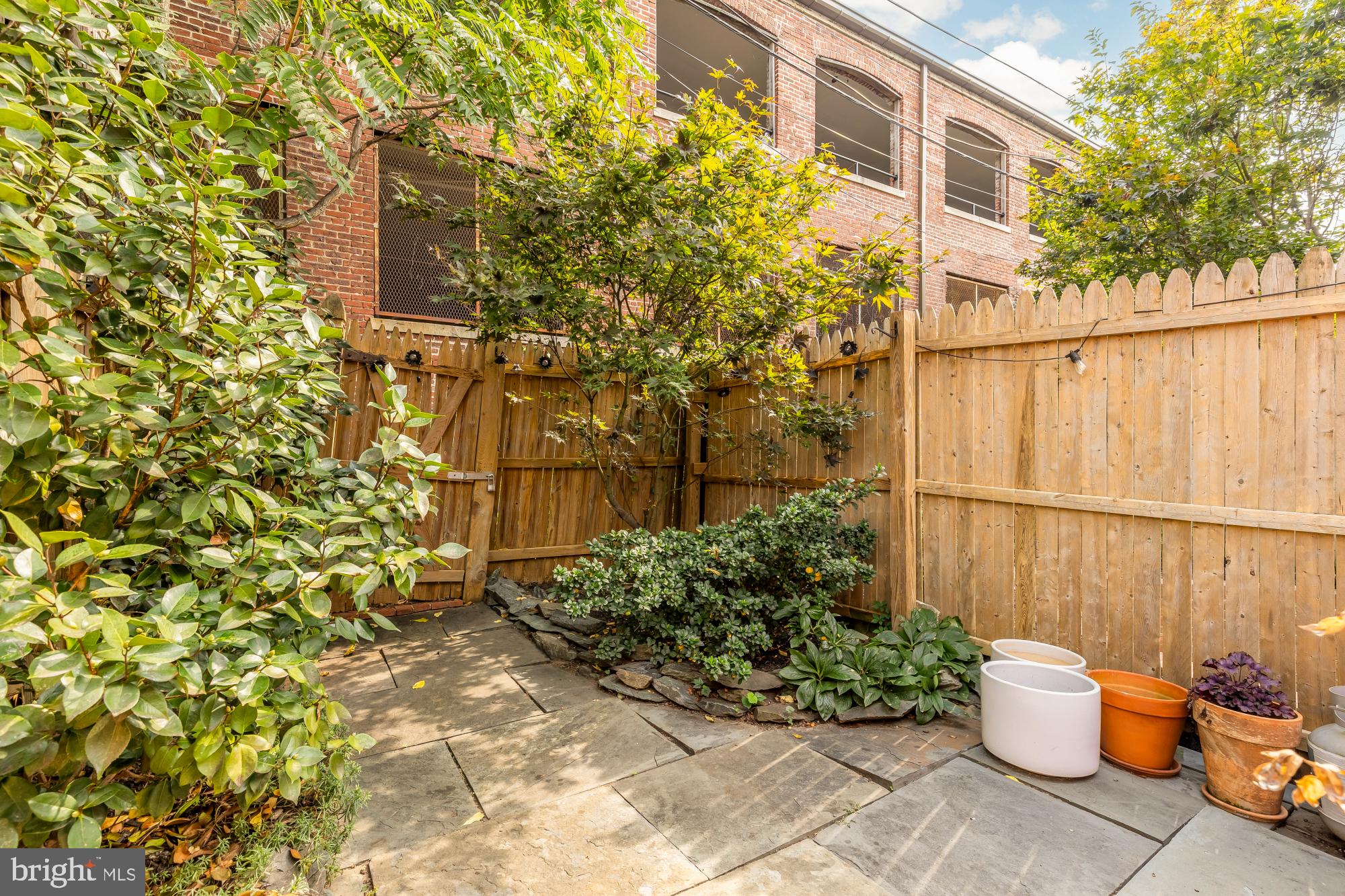 1652 Kalorama Road Northwest Washington, DC 20009 - Photo 8 of 17 a view of a backyard with plants and garden