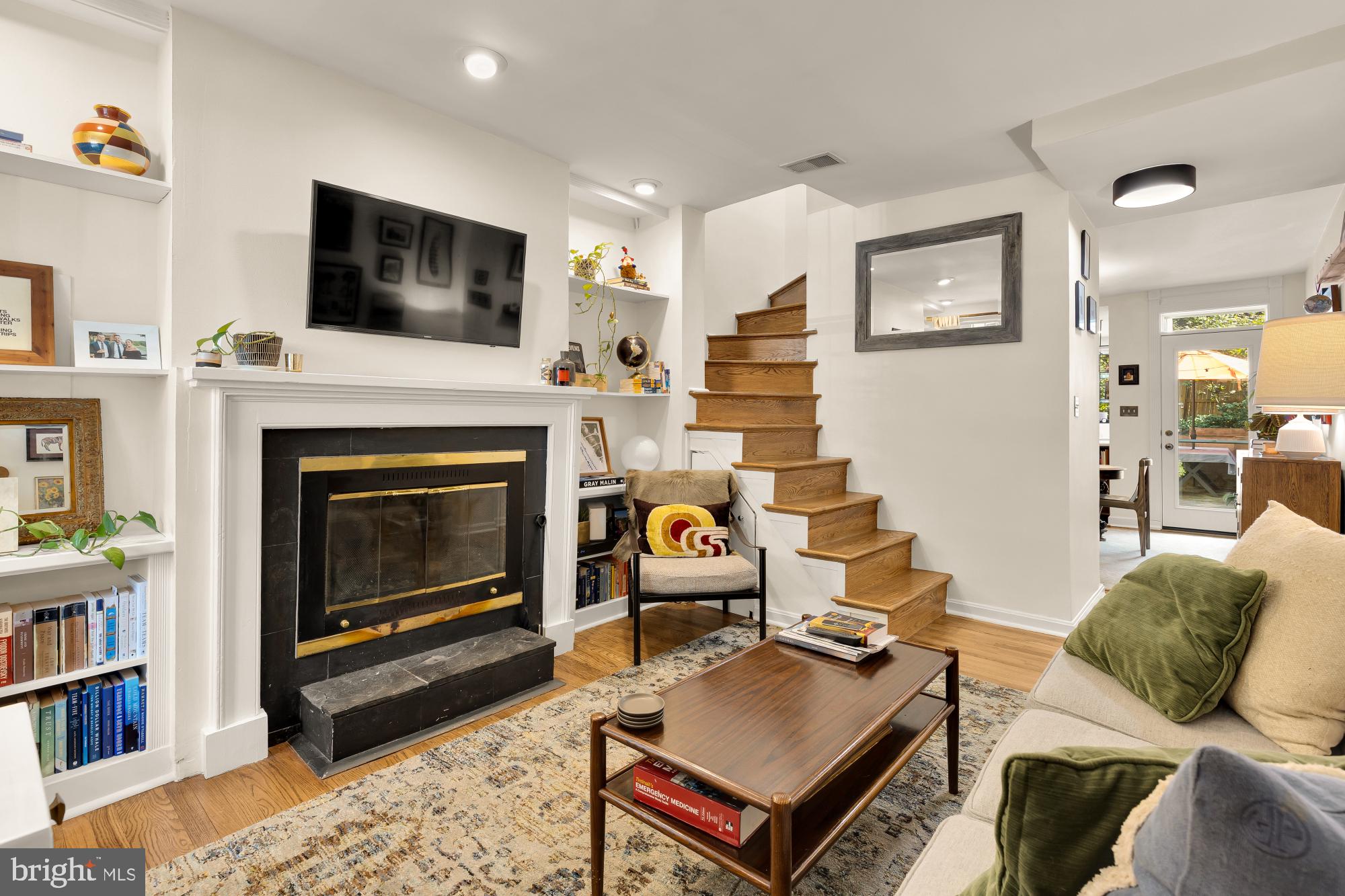 1652 Kalorama Road Northwest Washington, DC 20009 - Photo 10 of 17 a living room with furniture and a fireplace