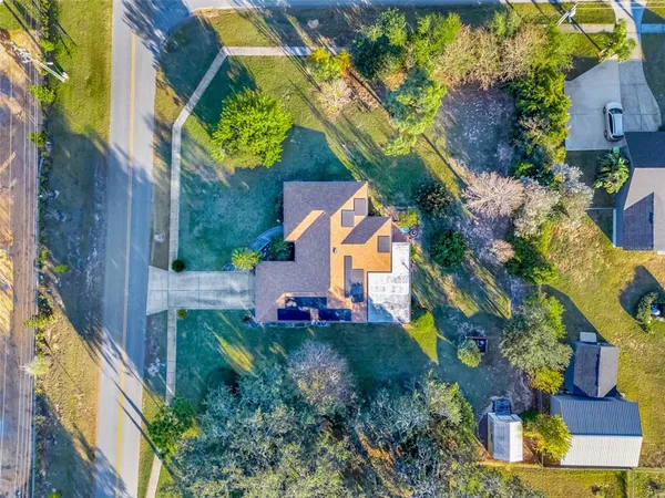 a view of a house with a yard and garden