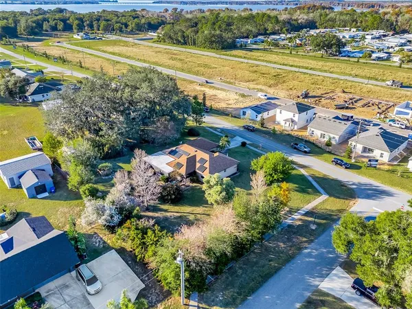 an aerial view of a house with a swimming pool yard and outdoor seating