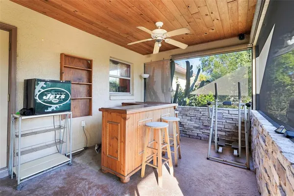 a dinning room with furniture and a flat screen tv