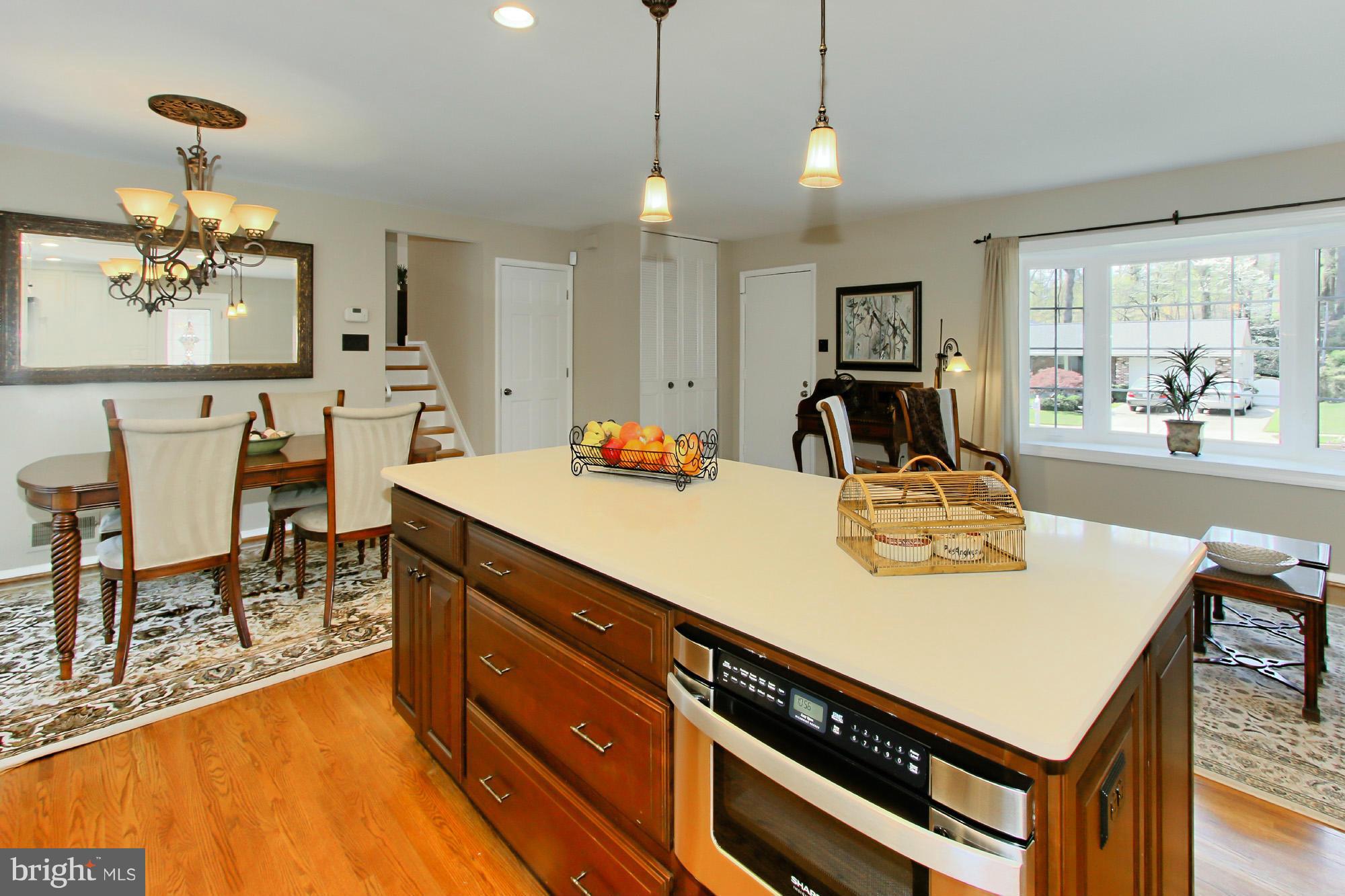 7012 Hadlow Drive Springfield, VA 22152 - Photo 13 of 30 a view of kitchen island with cabinets and wooden floor