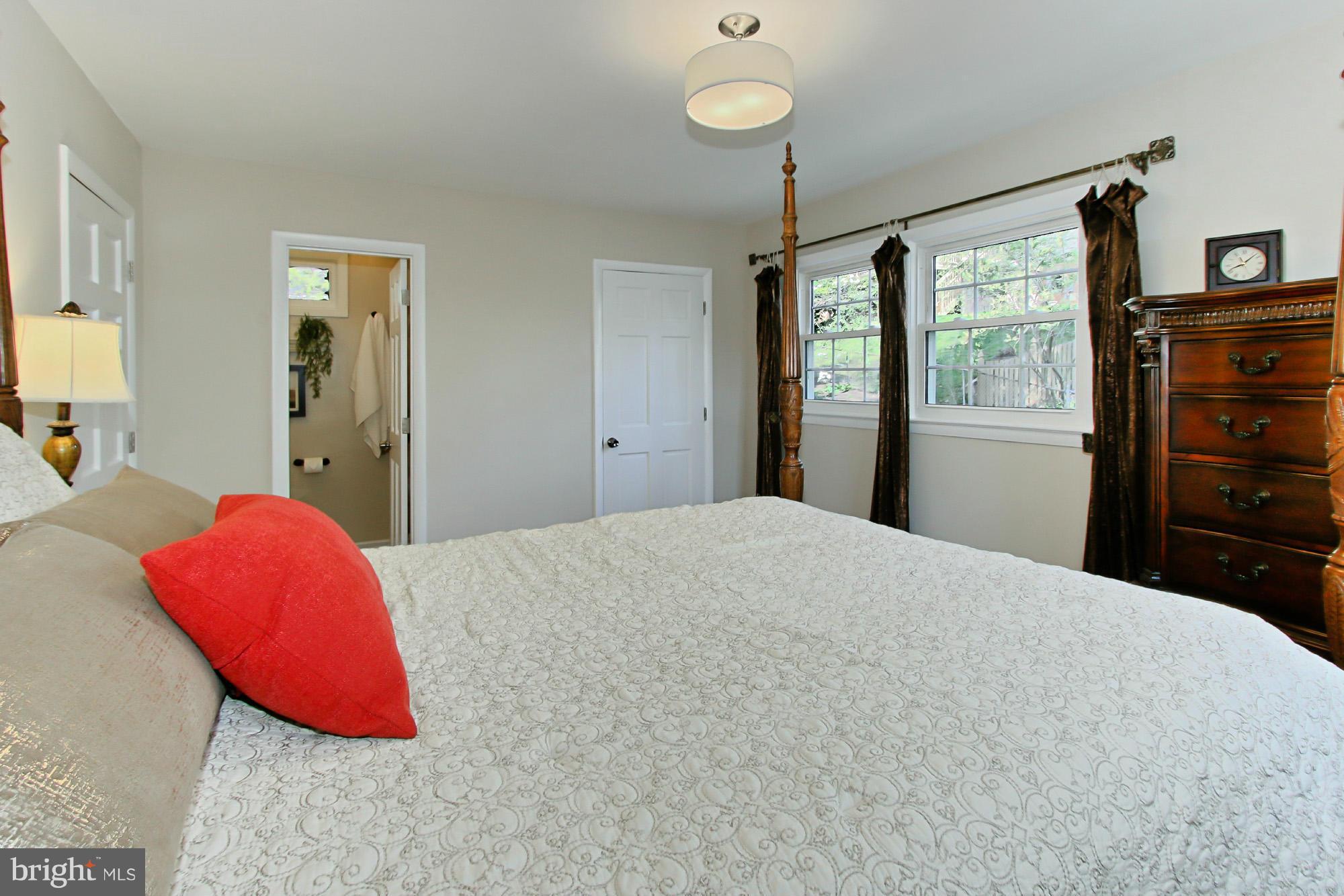 7012 Hadlow Drive Springfield, VA 22152 - Photo 15 of 30 a bedroom with a bed and a flat screen tv