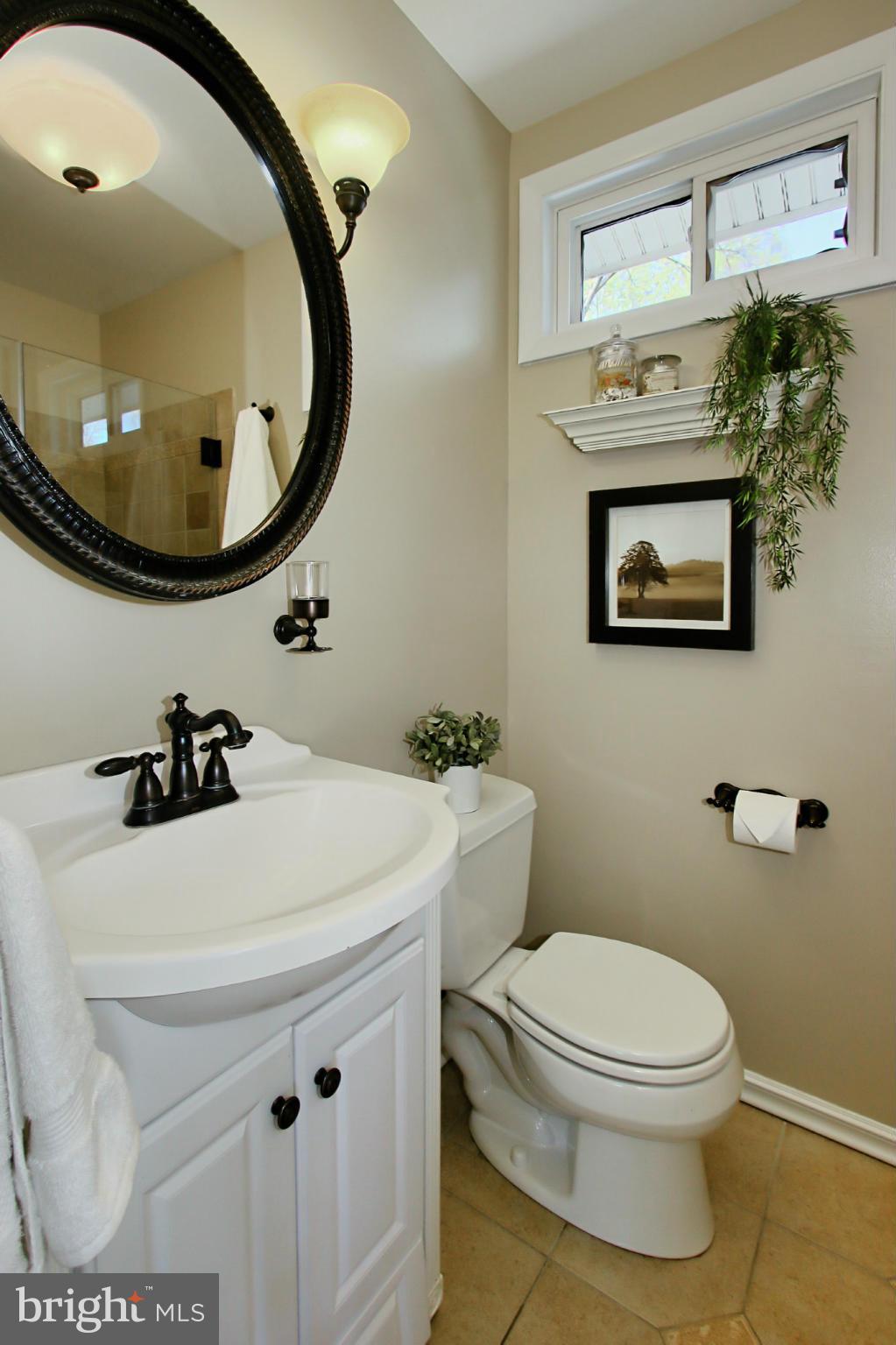 7012 Hadlow Drive Springfield, VA 22152 - Photo 16 of 30 a bathroom with a sink a mirror and toilet