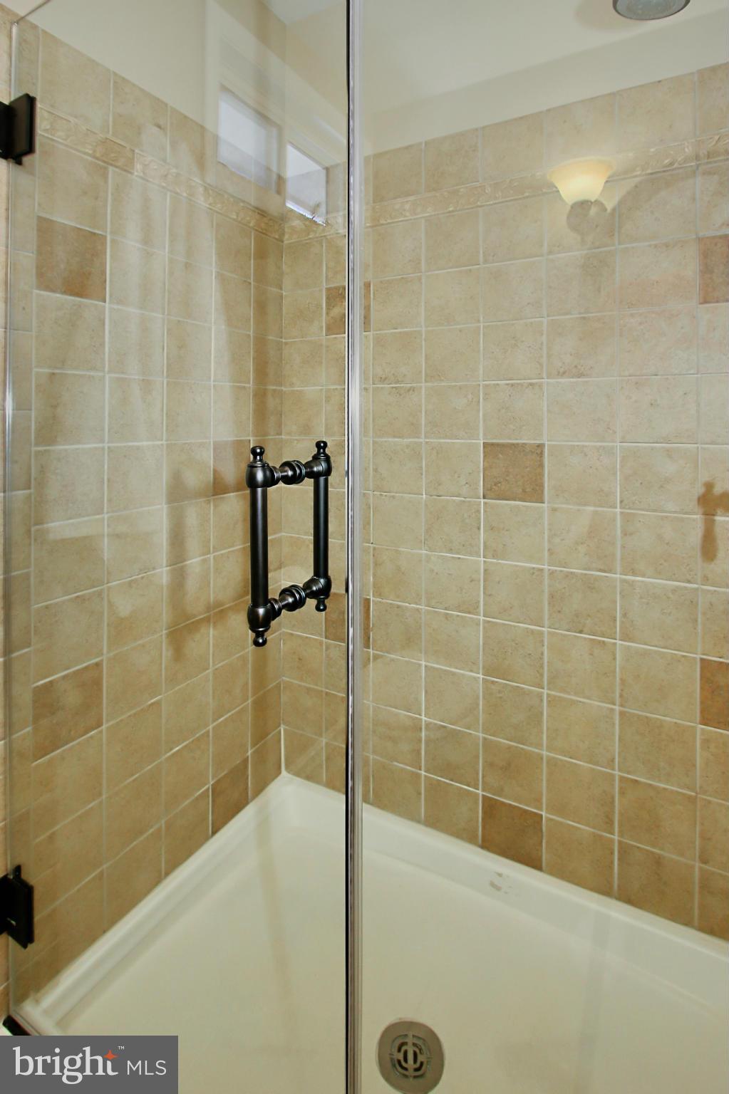 7012 Hadlow Drive Springfield, VA 22152 - Photo 17 of 30 a bathroom with a shower
