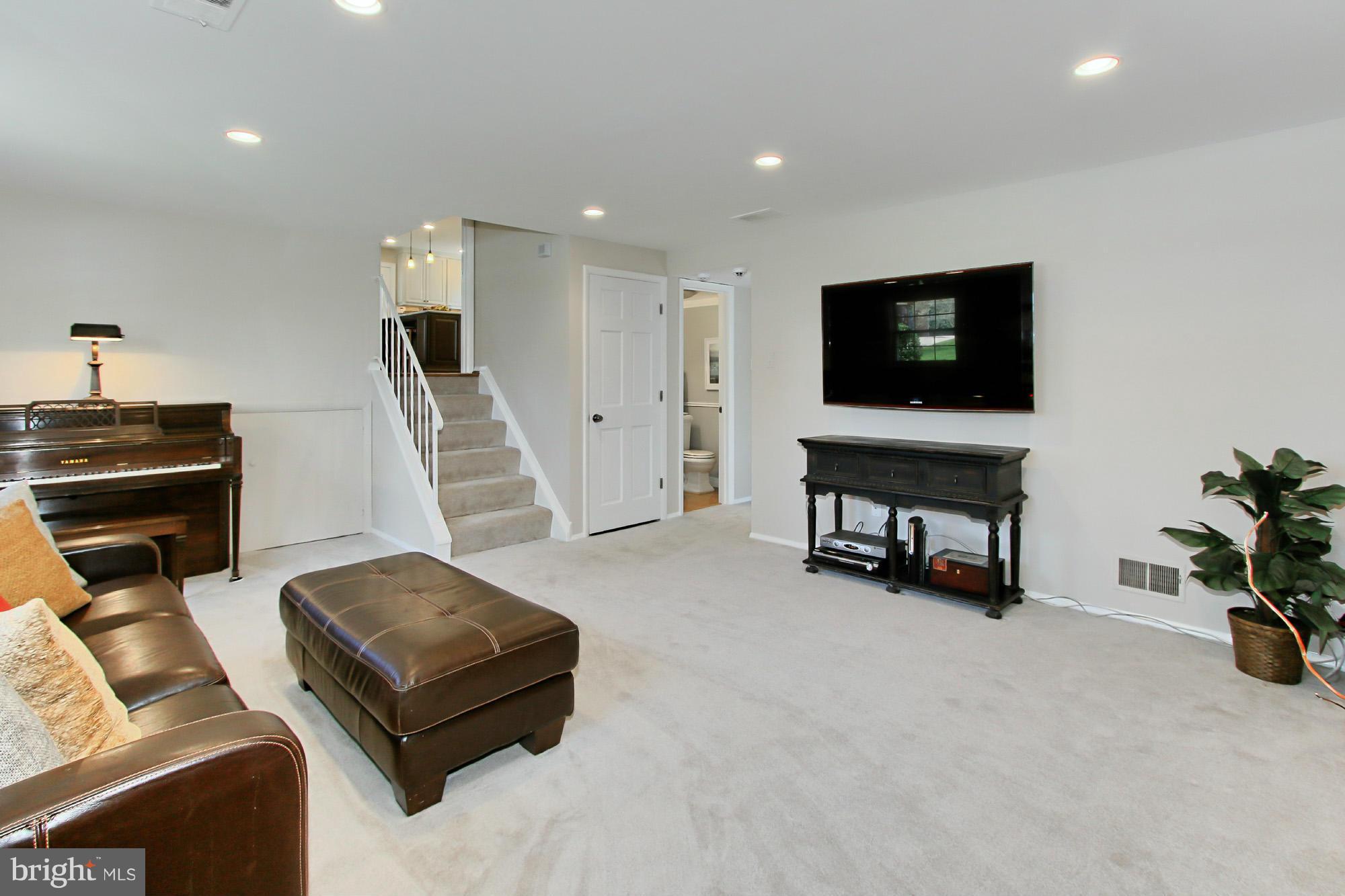 7012 Hadlow Drive Springfield, VA 22152 - Photo 25 of 30 a living room with furniture and a flat screen tv